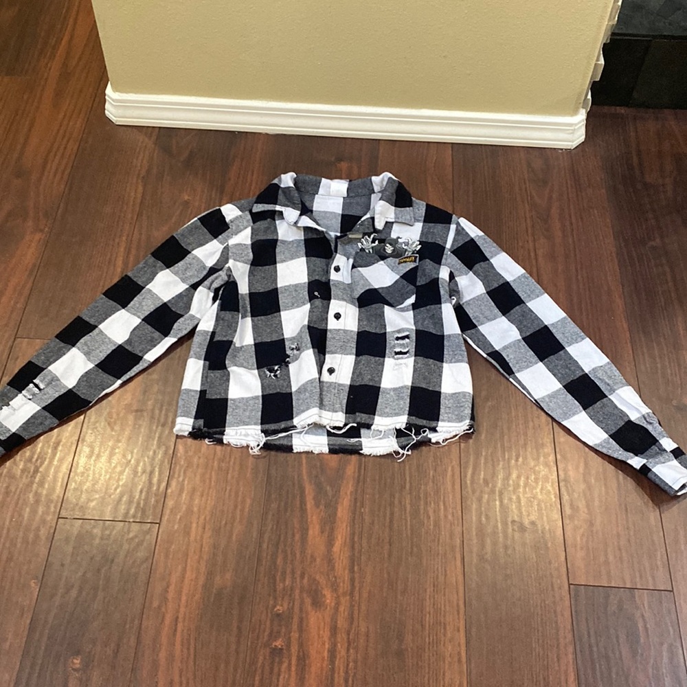 Women’s new with tags Spirit Halloween flannel shirt size small.